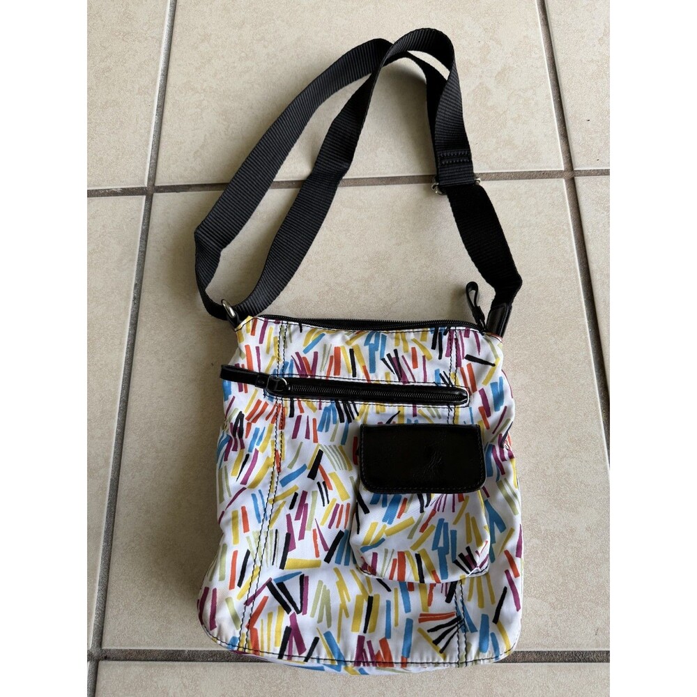 9 & Co. crossbody With outside zip pocket and outside snap pocket